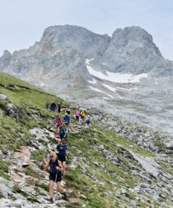 Group of hikers hiking in picos de europa mountain